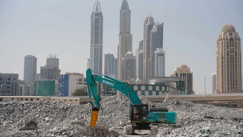 SK380 Kobelco excavator equipped with a JSC jackhammer.