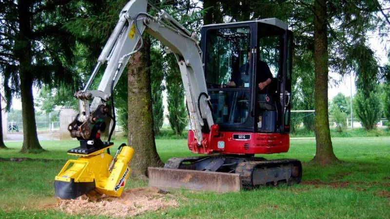 Mini digger attached to a stump grinder