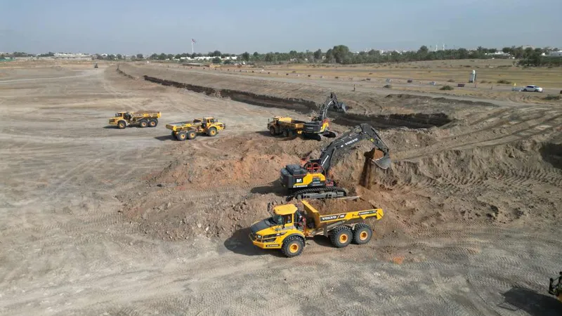 Large excavators and ADTs syncing together