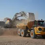 The Volvo A40G articulated Dump Truck with Volvo EC550 excavator at the Al Dhaid lake site.