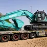 A large KOBELCO SK500 track excavator being loaded off to Saudi Arabia