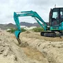 A Kobelco SK55 mini excavator on Al Marwan job site