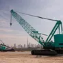 A couple of Al Marwan’s Kobelco 7250 crawler cranes on a job site