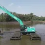 An amphibious SK210 excavator on a shallow waters job site - Image courtesy of Listar