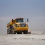 A fleet of Volvo A40G haulers move silt from the sea for on-site aggregate processing in Abu Dhabi, UAE