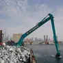 An SK850 large excavator equipped with a 26m long boom