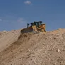 CAT D8T bulldozer at work on a desert construction site in Abu Dhabi, UAE as part of Al Marwan Heavy Machinery equipment rental fleet