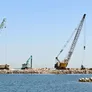 Various Al Marwan crawler cranes on a Oman job site, including the Kobelco CKS1350 crawler crane