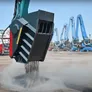 A World Attachments crushing bucket at work, sifting mixed soil