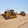 Komatsu D155A dozers grading the plot for the residential and commercial structures at Tilal City