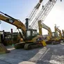 Al Marwan's lineup of CAT and Komatsu medium track excavators at our used equipment showroom in Sharjah, UAE
