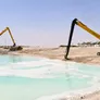 long-reach boom excavators at work on a construction site - Al Marwan Machinery