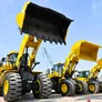 Different weight class Komatsu loaders at Al Marwan’s yard, including the WA900, WA600, WA470