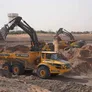 Diggers and ADTs on a job site as part of Al Marwan rental fleet