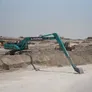 The 85-ton Kobelco SK850 long-boom excavator being operated on a sea dredging job as part of Al Marwan Heavy Machinery's equipment rental fleet in UAE