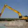 A Komatsu PC850 Long Reach Digger fitted with a 21-meter boom and Jisung Jackhammer