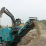 Mobile jaw crushers reduce the size of the rocks.