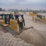Multiple Al Marwan rental dozers on a job site, including CAT D8T, CAT D9R, Komatsu D475A