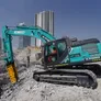KOBELCO SK380 excavator coupled with a Jisung JSC jackhammer on a demolition job in Dubai