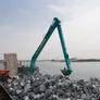 The KOBELCO SK850 excavator is equipped with a 26-meter long-reach boom