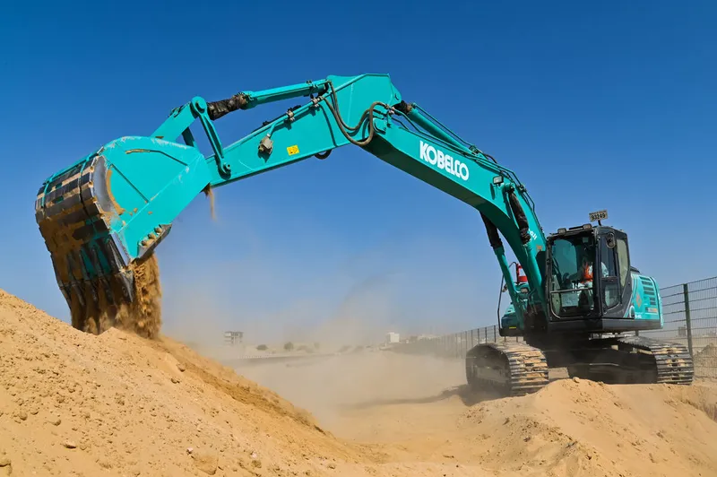 A Kobelco SK220 medium excavator on Al Marwan job site