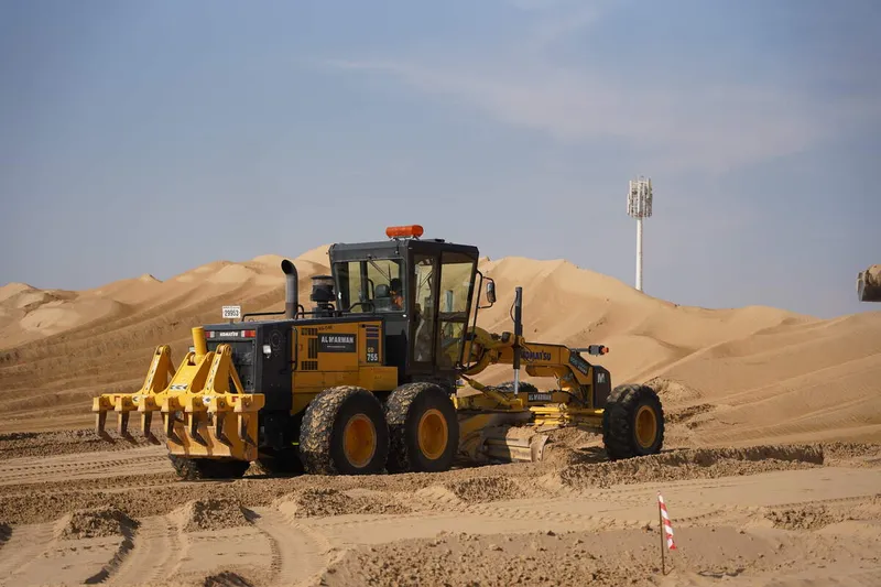 A Komatsu GD755 grader on the Hayyan by Alef work site