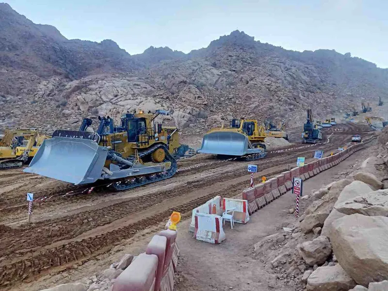 A fleet of Al Marwan rental dozers, including CAT D11, on a NEOM worksite