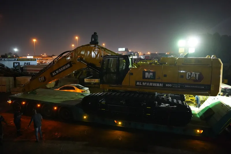 The large CAT 395 long-reach excavator being mobilized to the movie set in Abu Dhabi