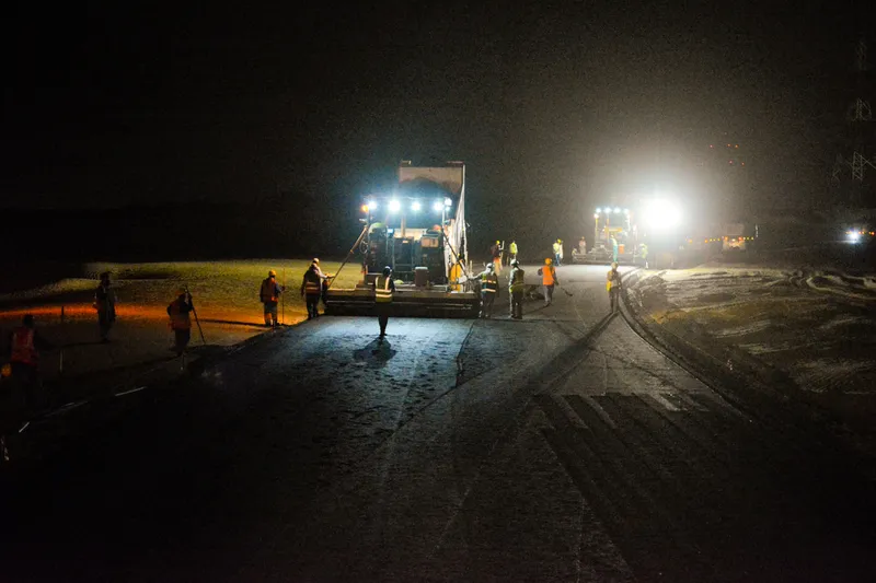 The asphalt and road marking division of Al Marwan's equipment rental fleet hard at work at night