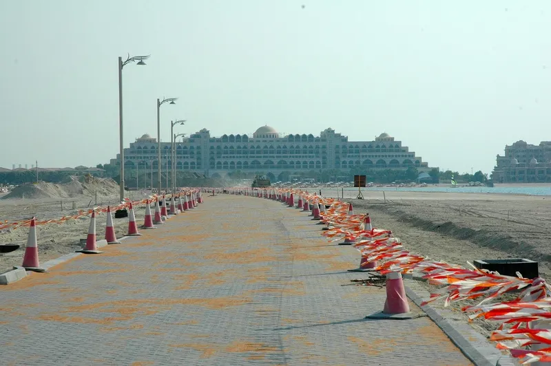 Road on Frond N of Palm Jumeirah overlooking landmarks in Dubai. Al Marwan Machinery
