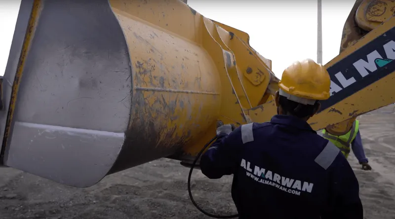 Apply grease to the lift and tilt arms on your wheel loader