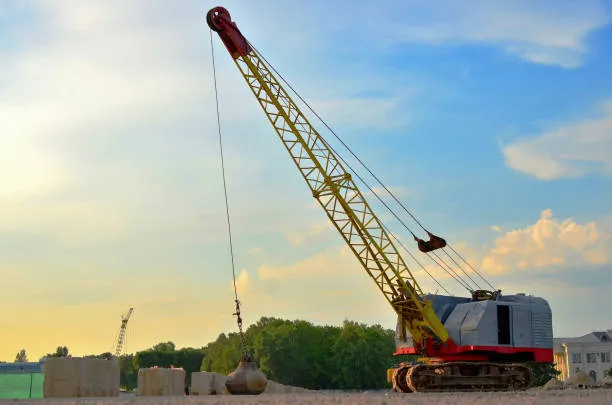Crawler crane with a wrecking ball