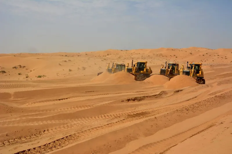 multiple sized komatsu dozers