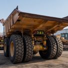 2021 Caterpillar 777E Rigid Dump Truck Rear Left View