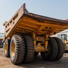 2022 Caterpillar 777E Rigid Dump Truck Rear Left View