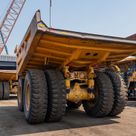 2022 Caterpillar 777E Rigid Dump Truck Rear Left View