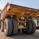 2022 Caterpillar 777E Rigid Dump Truck Rear Left View