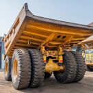 2023 Caterpillar 777 Rigid Dump Truck Rear Left View